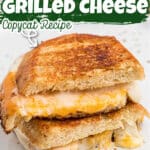 A starbucks grilled cheese cut in half with text overlay for pinterest.