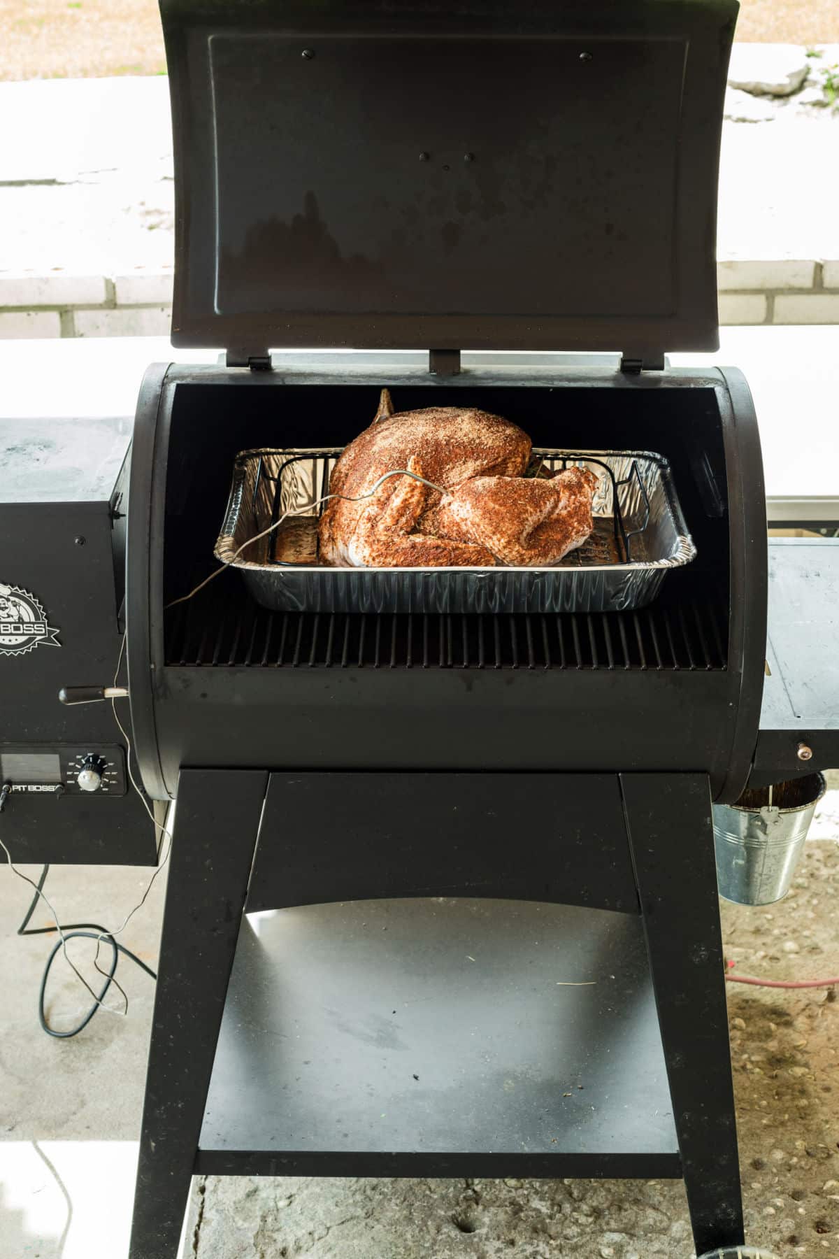 A turkey about to be smoked on a pellet grill.