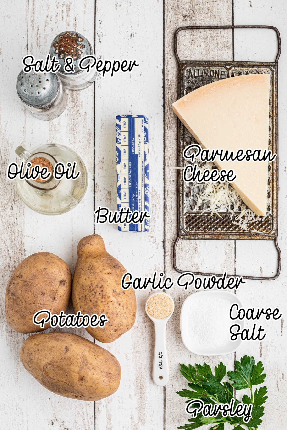 Ingredients laid out, that is needed to make slow cooker roast potatoes with text overlay.