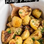 A crock pot with roast potatoes and text overlay for pinterest.