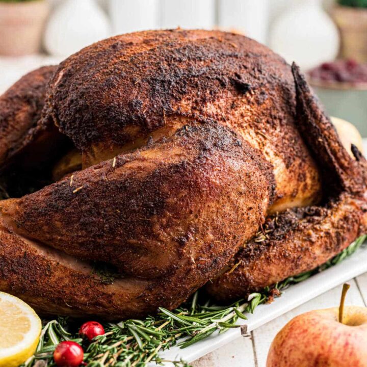 A whole turkey that has been cooked with a smoked turkey injection recipe.