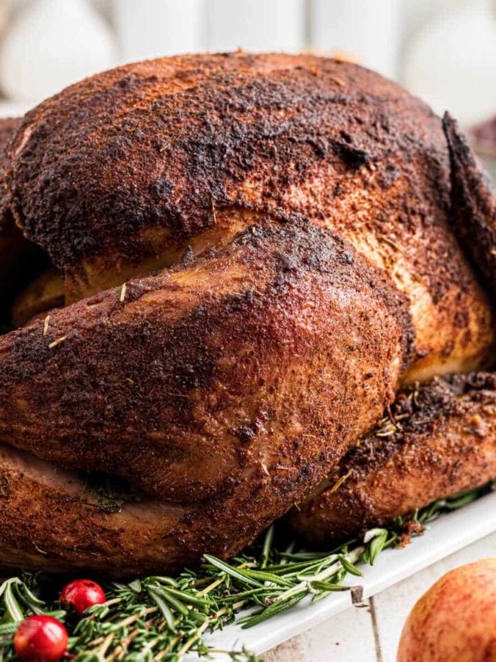 A whole turkey that has been cooked with a smoked turkey injection recipe.