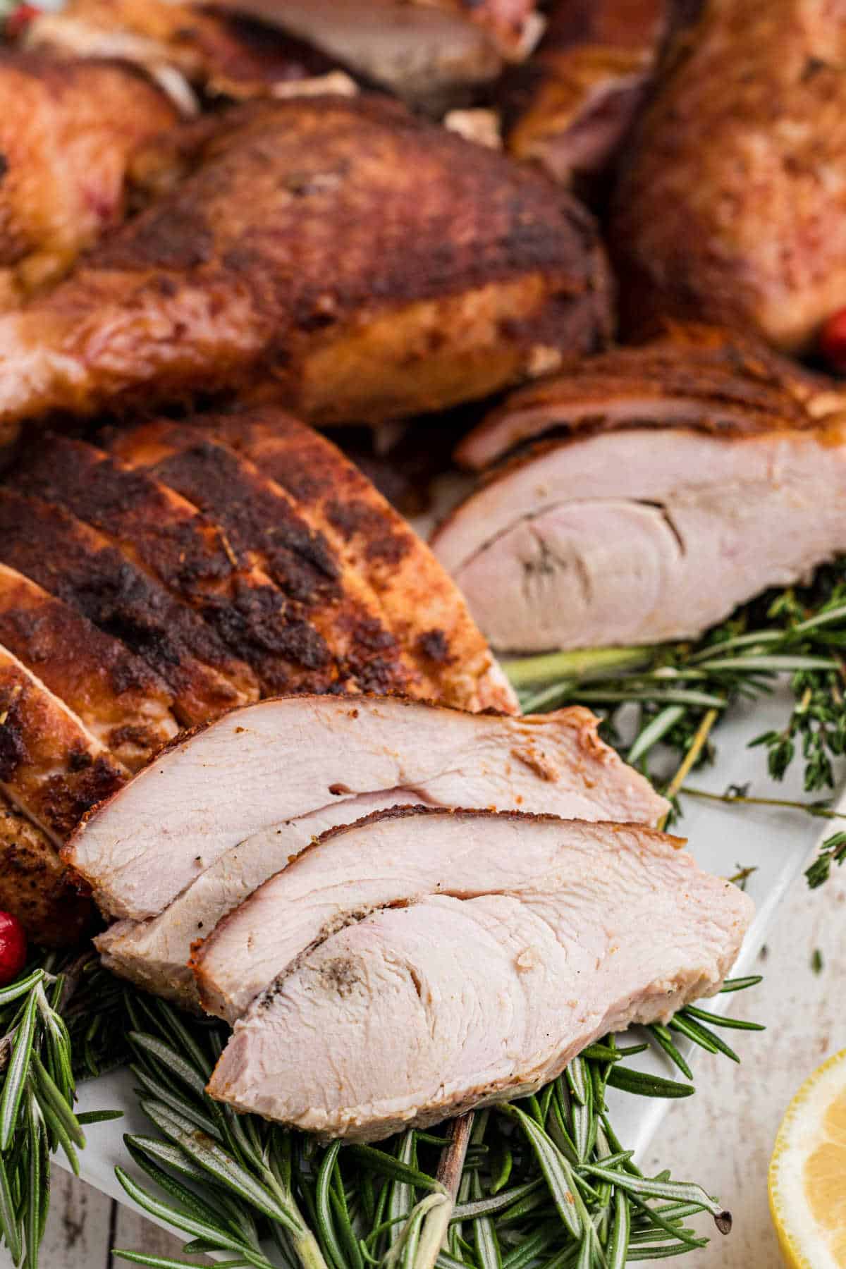Sliced turkey that has been cooked using a smoked turkey rub recipe.