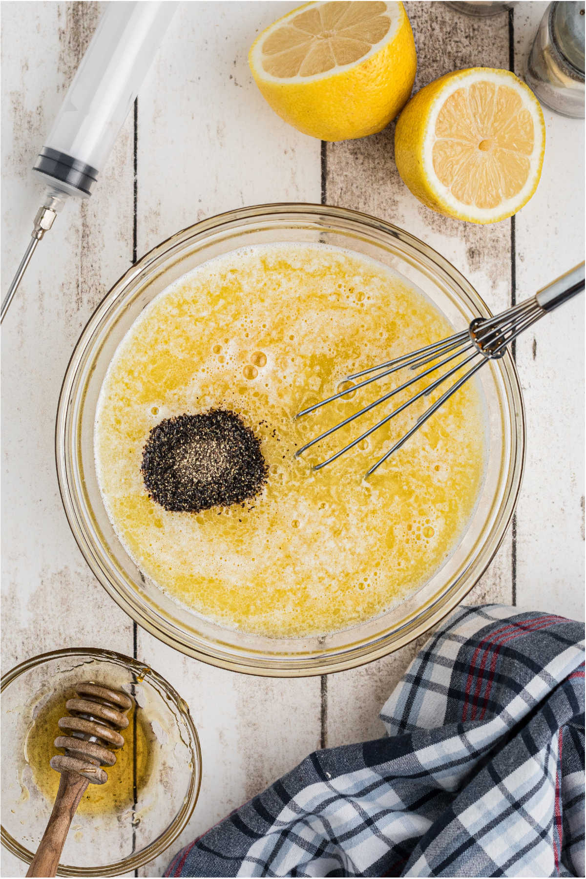 A small mixing bowl filled with butter and seasonings.