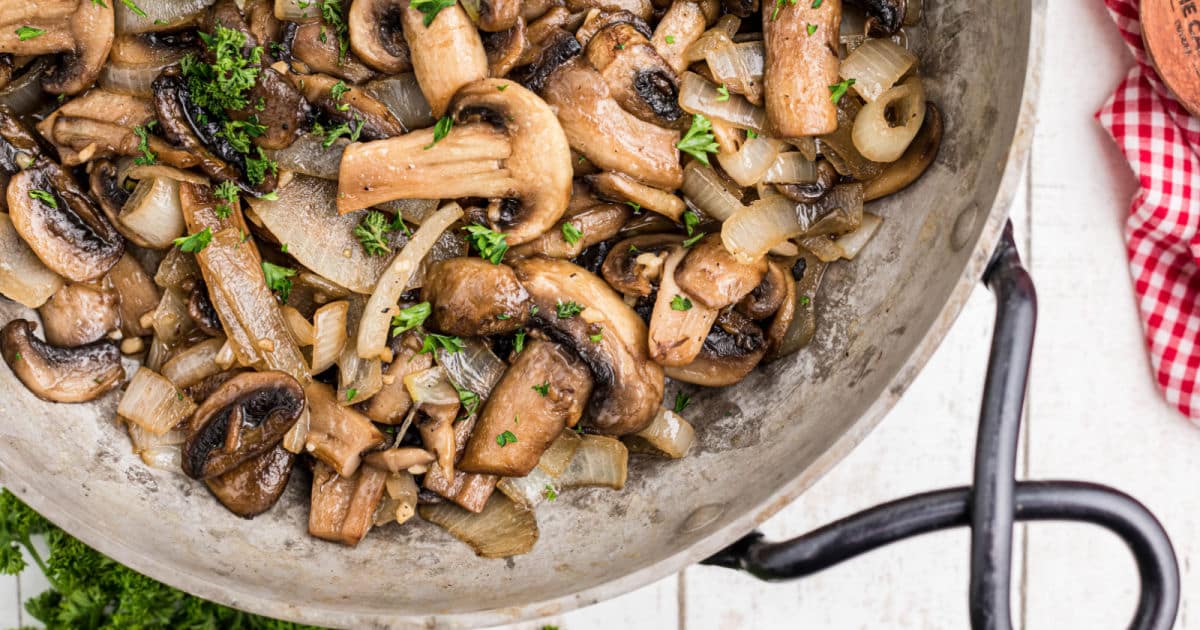 Close up of a skillet with Texas Roadhouse Sauteed Mushrooms.
