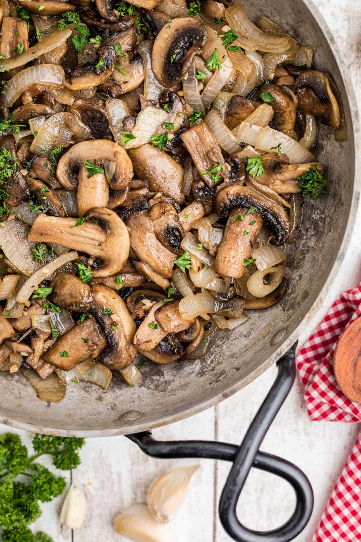Overhead close up shot of a skillet with Texas Roadhouse Sauteed Mushrooms Recipe.
