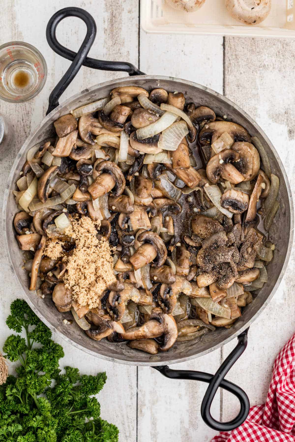Overhead shot of ingredients being added for Texas Roadhouse Sauteed Mushrooms Recipe.