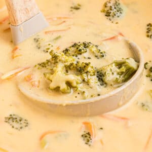 Close up of some 30 minute broccoli cheddar soup in a ladle.