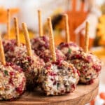 Close up image of cranberry pecan cheese ball bites with text overlay for pinterest.