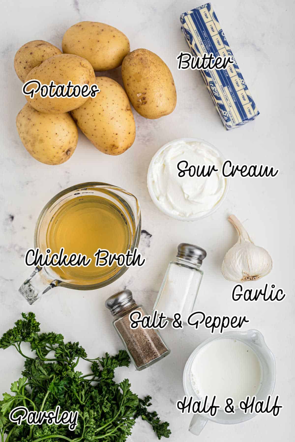 Overhead image of ingredients needed to make a slow cooker mashed potatoes with chicken broth recipe.