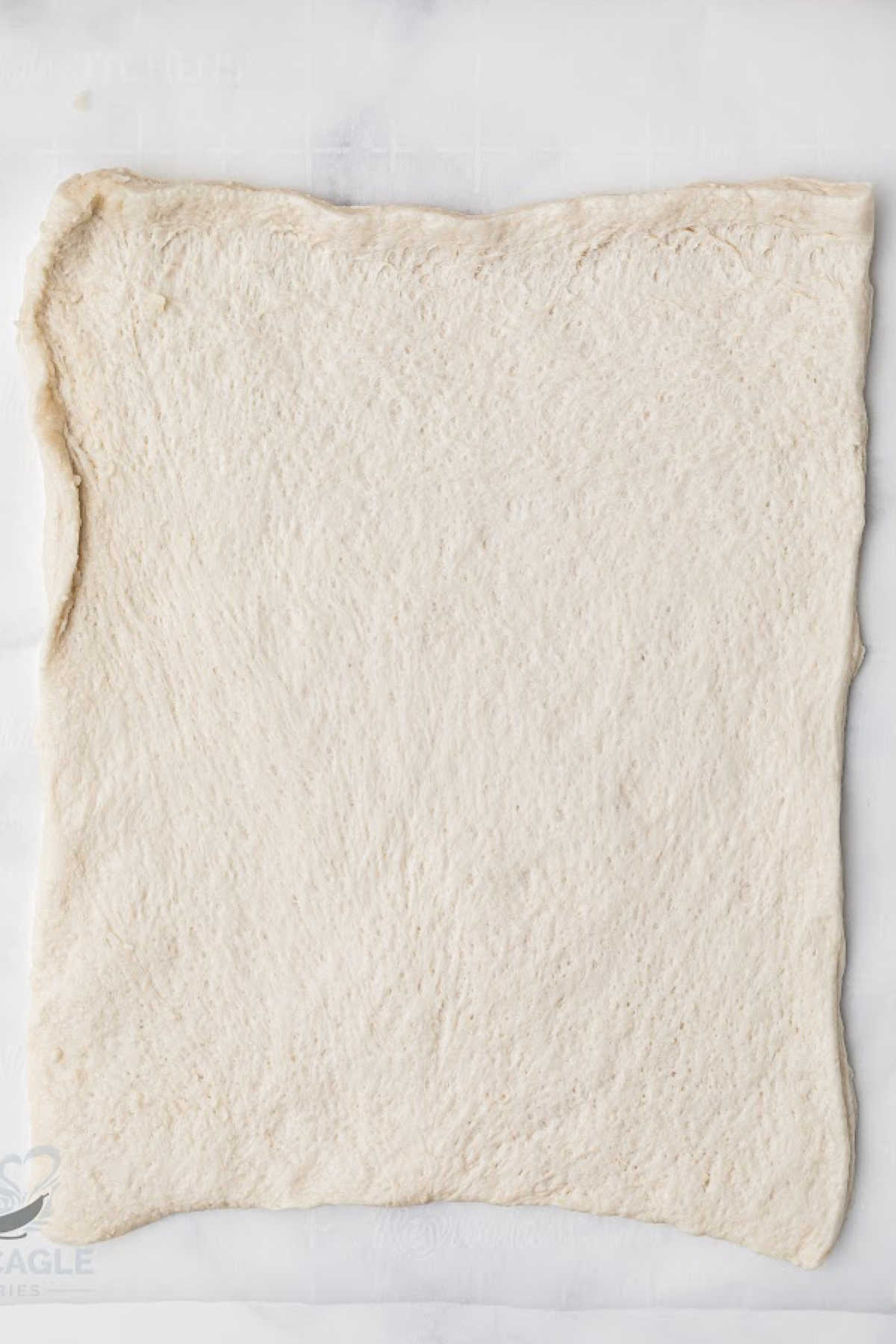 An unrolled sheet of puff pastry.