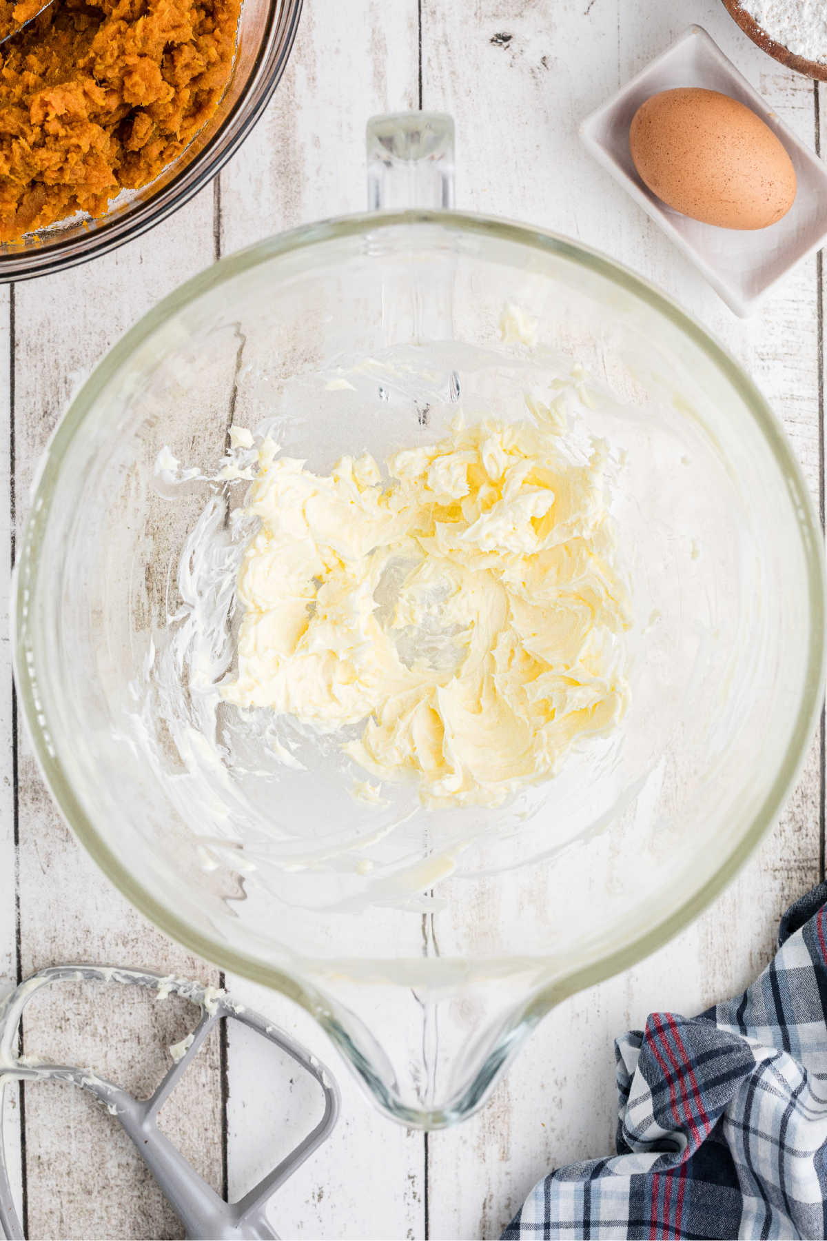 Mixing bowl filling with butter.