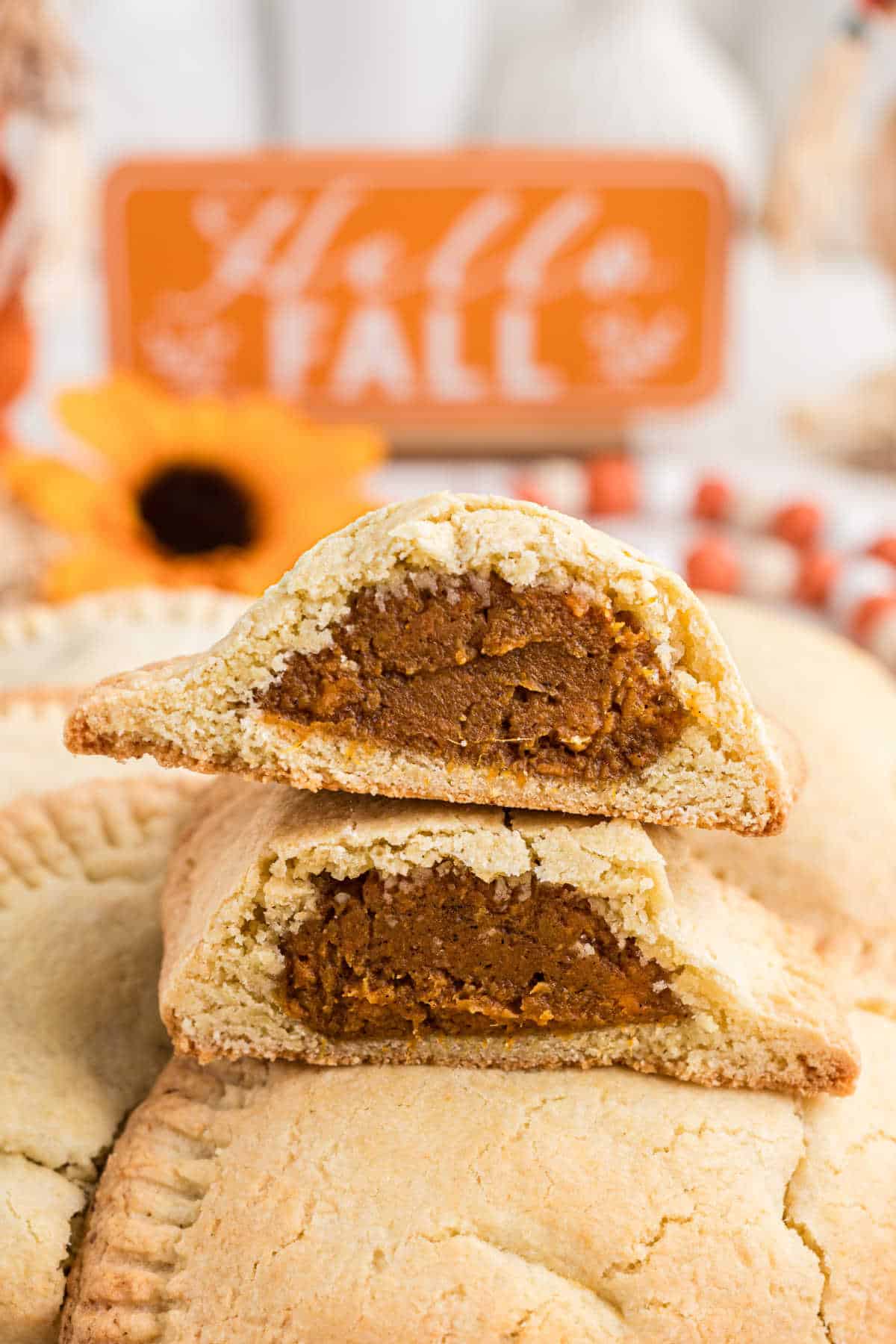 Sweet Potato Hand Pies cut in half with fall decor.