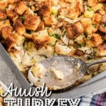 Corner to an Amish turkey stuffing recipe, with a spoon resting there. Text overlay for pinterest.