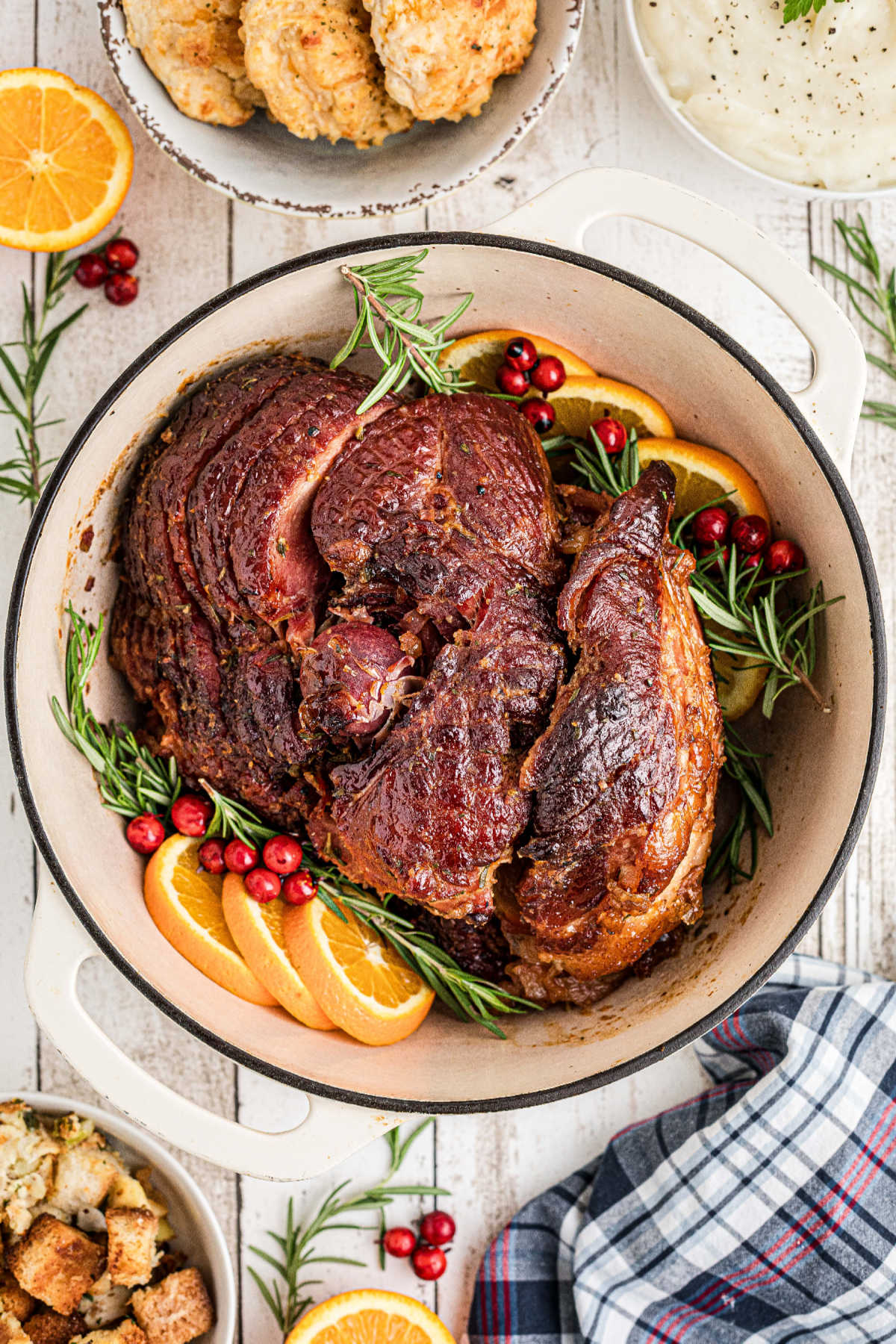 A baked ham inside a Dutch oven.
