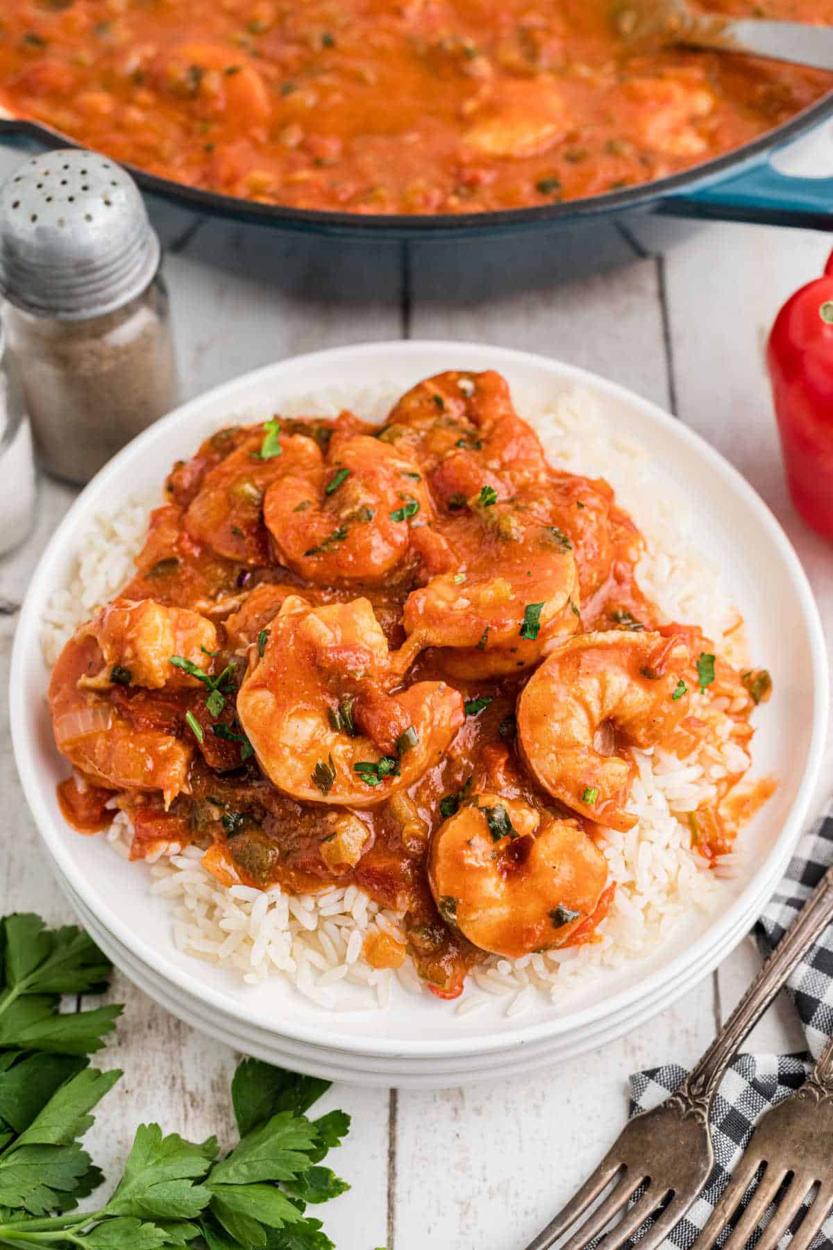 A dished up plate of new orleans style shrimp creole on a bed of rice.