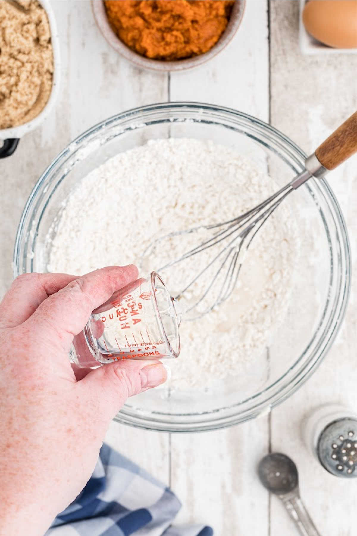 A little water being added to a flour mixture.