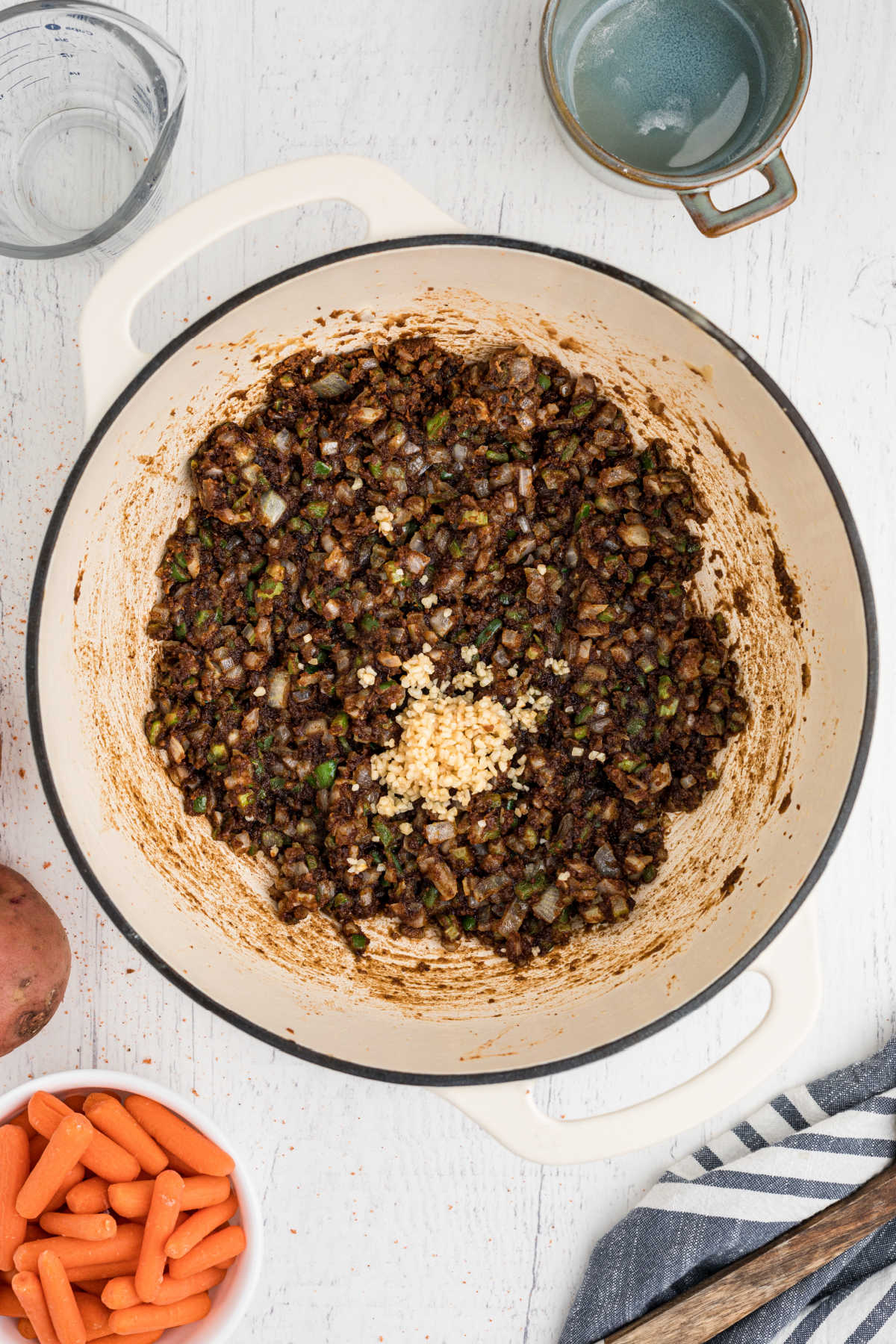 Minced garlic added to a roux with veggies.