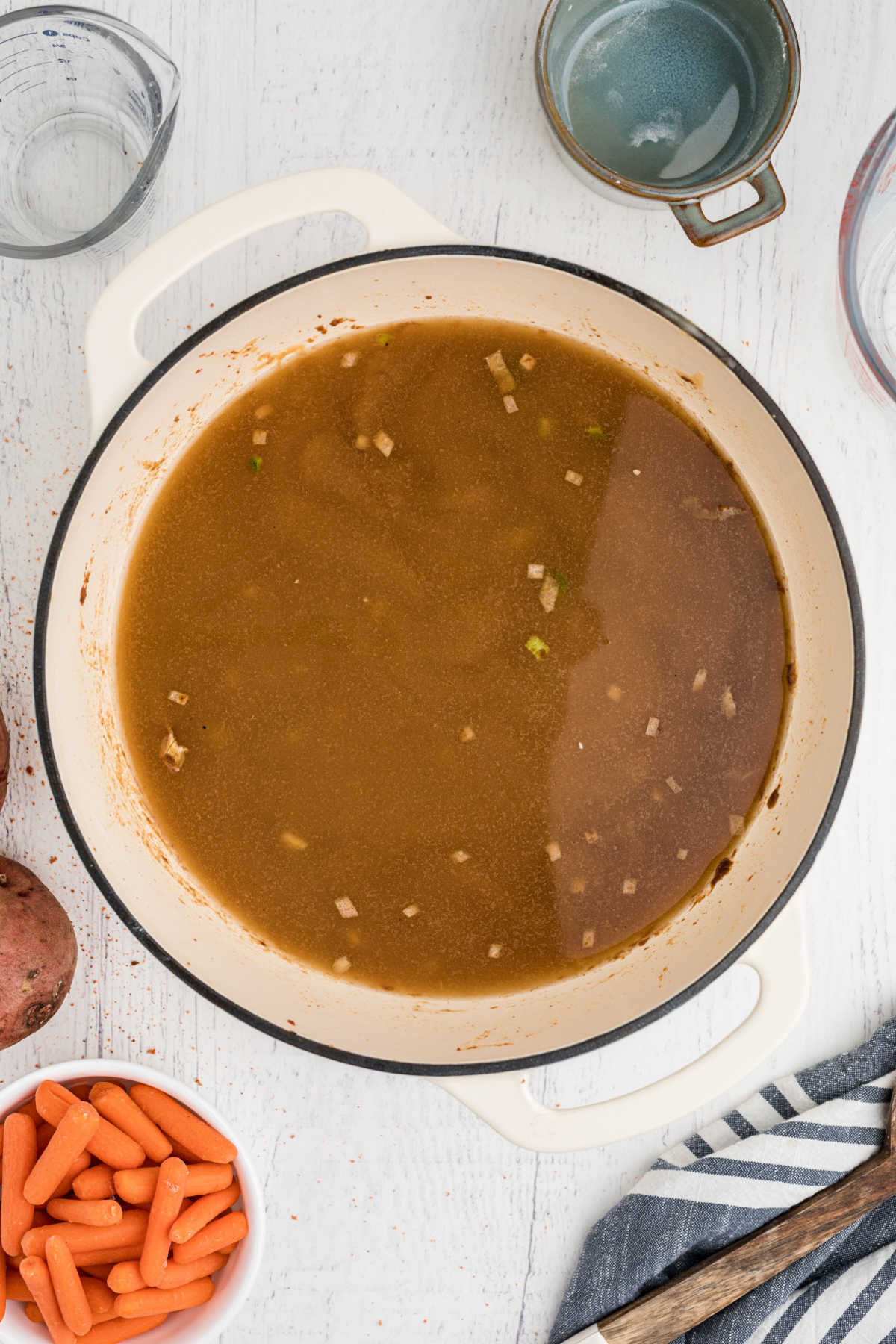 A large pot with a brown looking gravy.