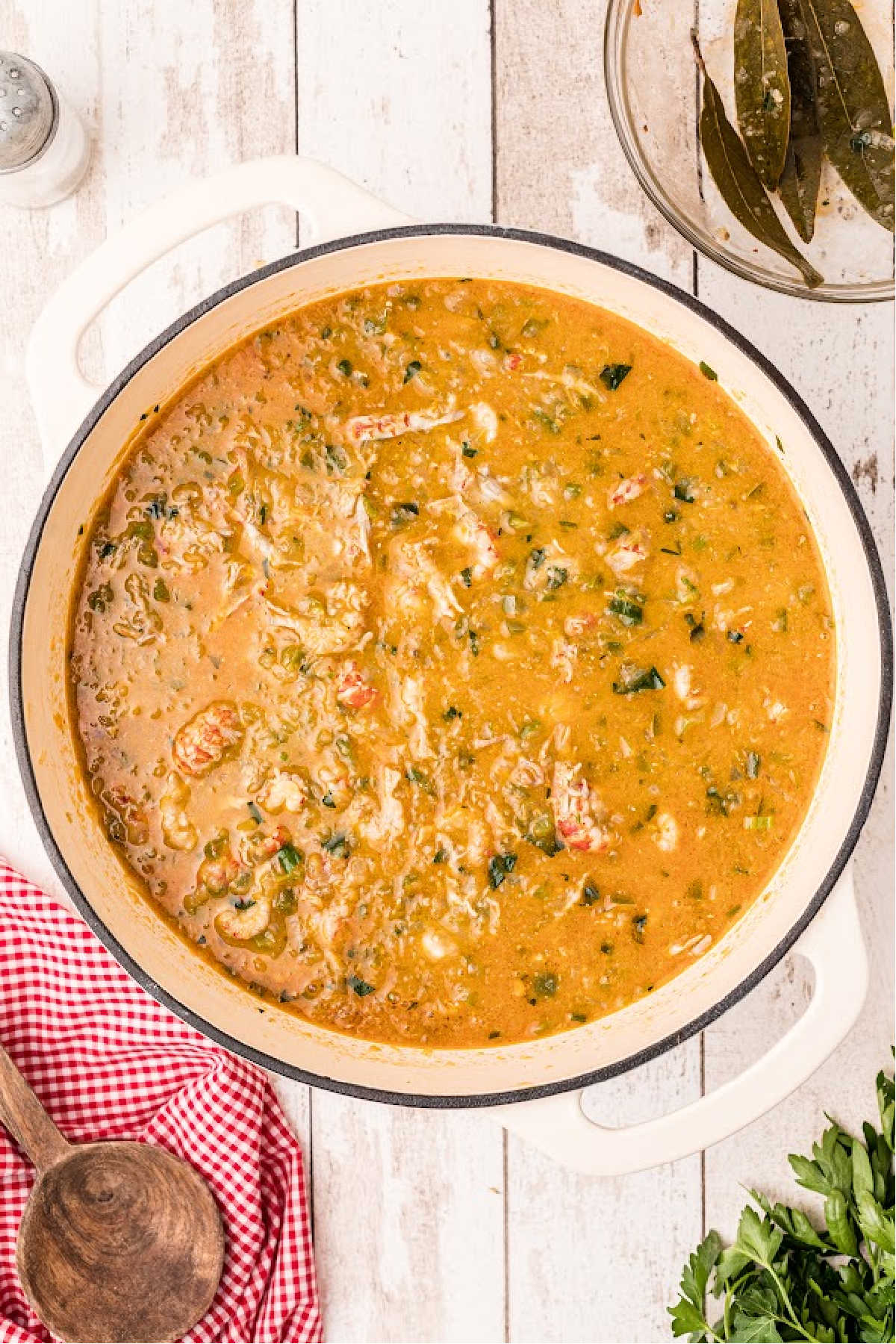A large Dutch oven filled with Crawfish Etouffee.