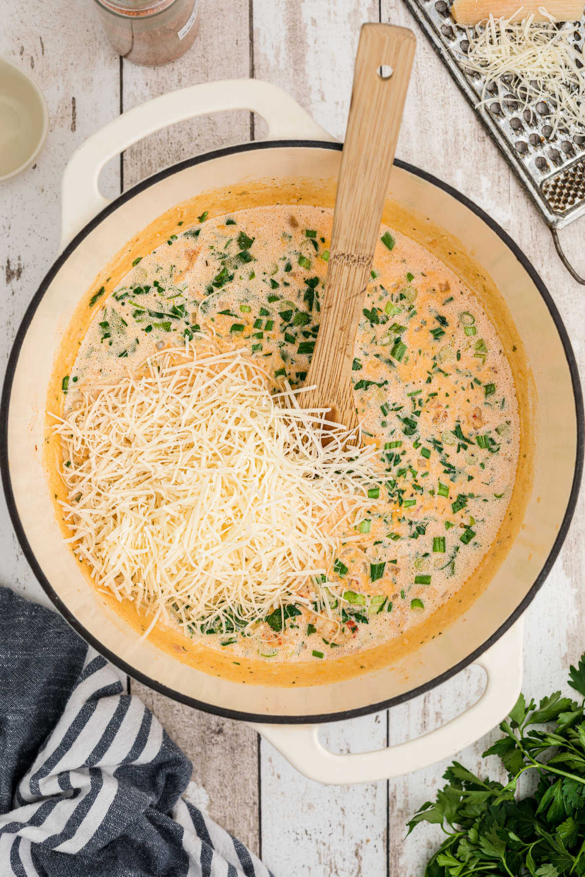 Freshly grated parmesan added to a sauce.