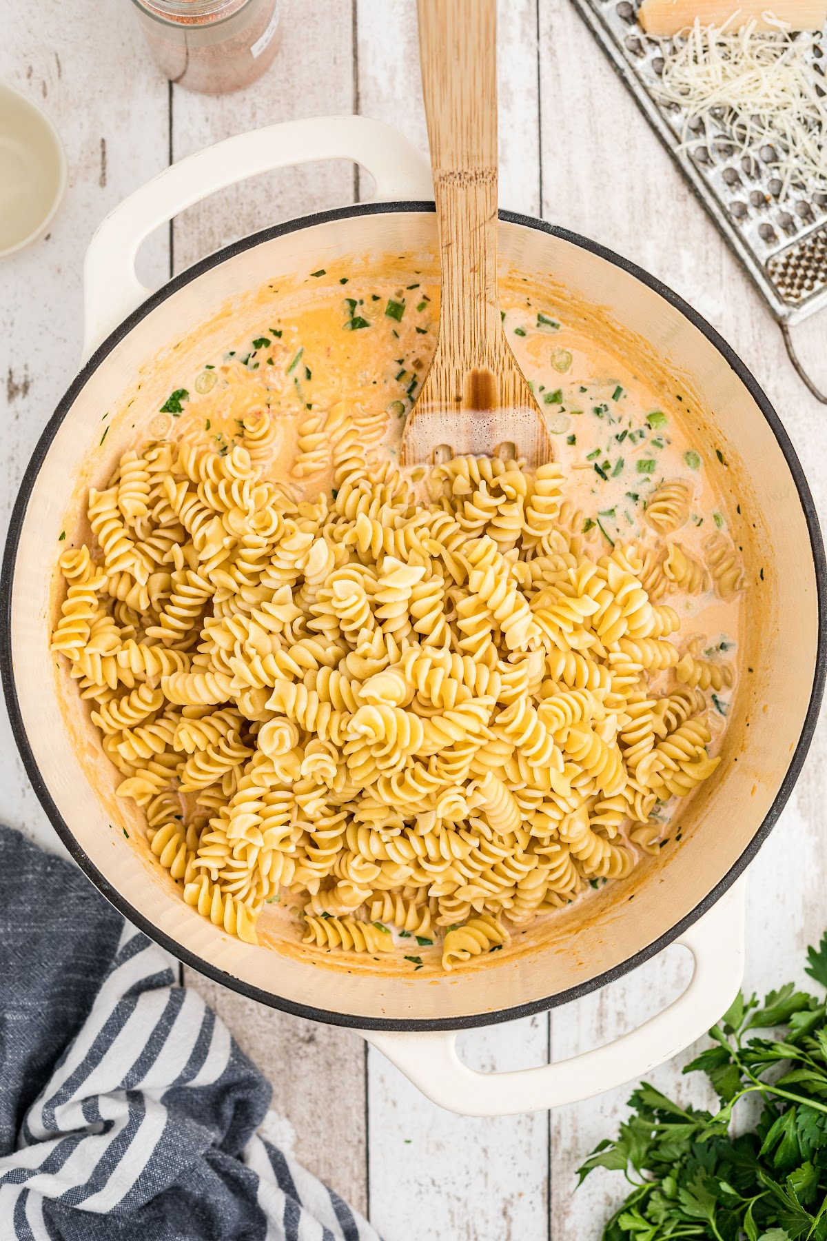 Cooked noodles added to creamy crawfish sauce.