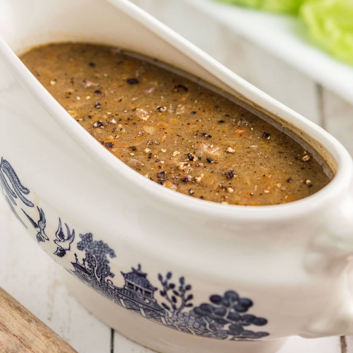 Close up of southern giblet gravy in a gravy boat.