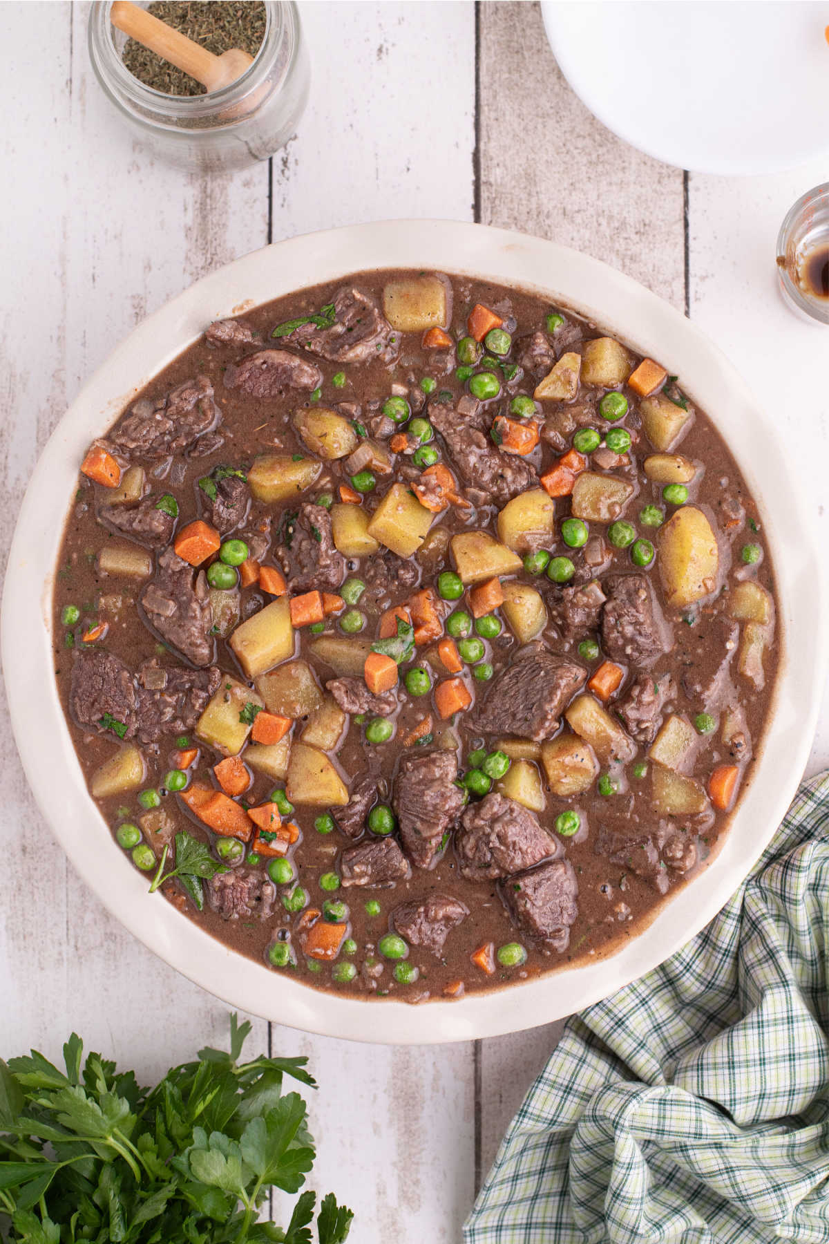 Beef pot pie filling in a large deep dish pie dish.