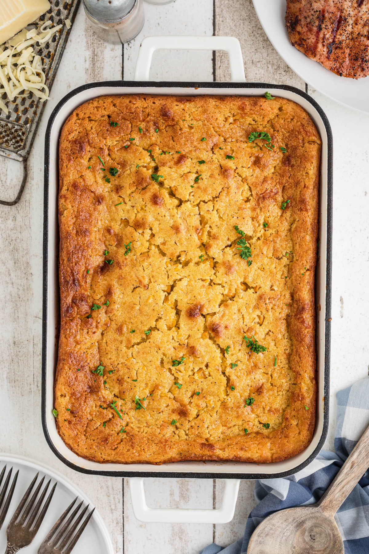 Overhead view of a dish of cornbread pudding.