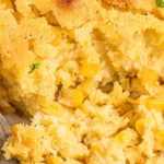 Close up of some cornbread pudding, with text overlay for pinterest.