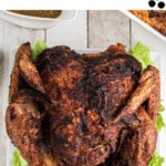 A long image showing a deep fried turkey with text above for pinterest.