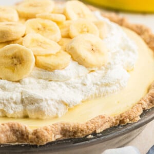 A dish with banana cream pie, cropped square.