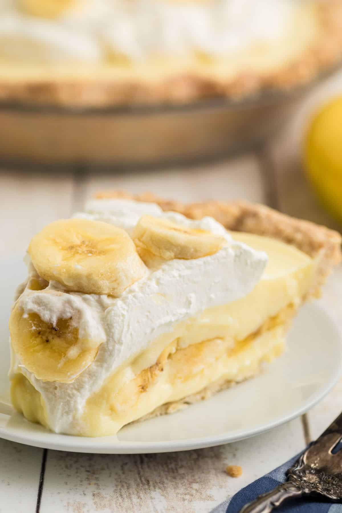 A slice of banana cream pie, with sliced bananas on top.