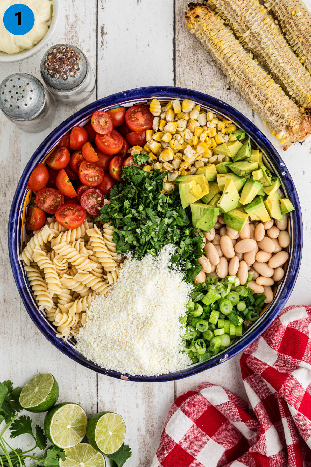 Ingredients needed to make Elotes pasta salad, laid out in a bowl.