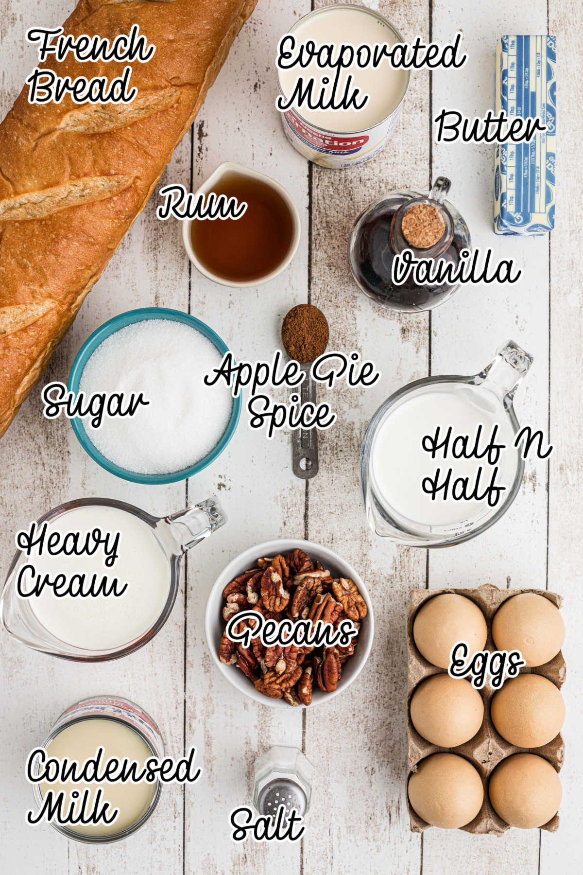 Ingredients needed to make bread pudding with rum sauce, with text overlay.