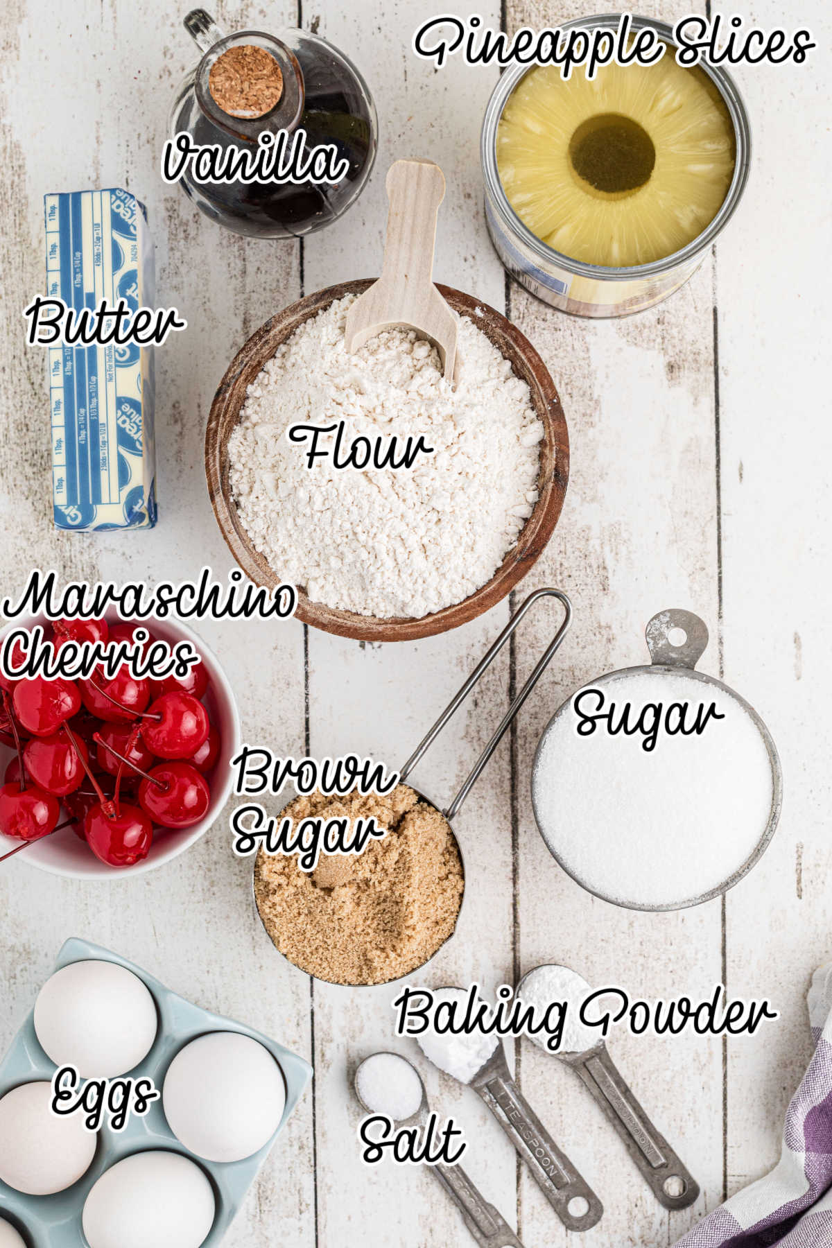 Overhead picture of the ingredients needed to make pineapple upside down cake, with text overlay.