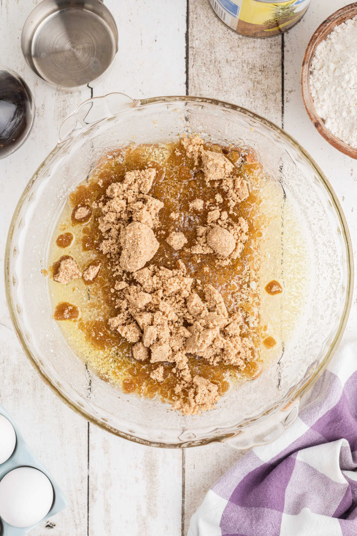A pie dish with butter and brown sugar in it.
