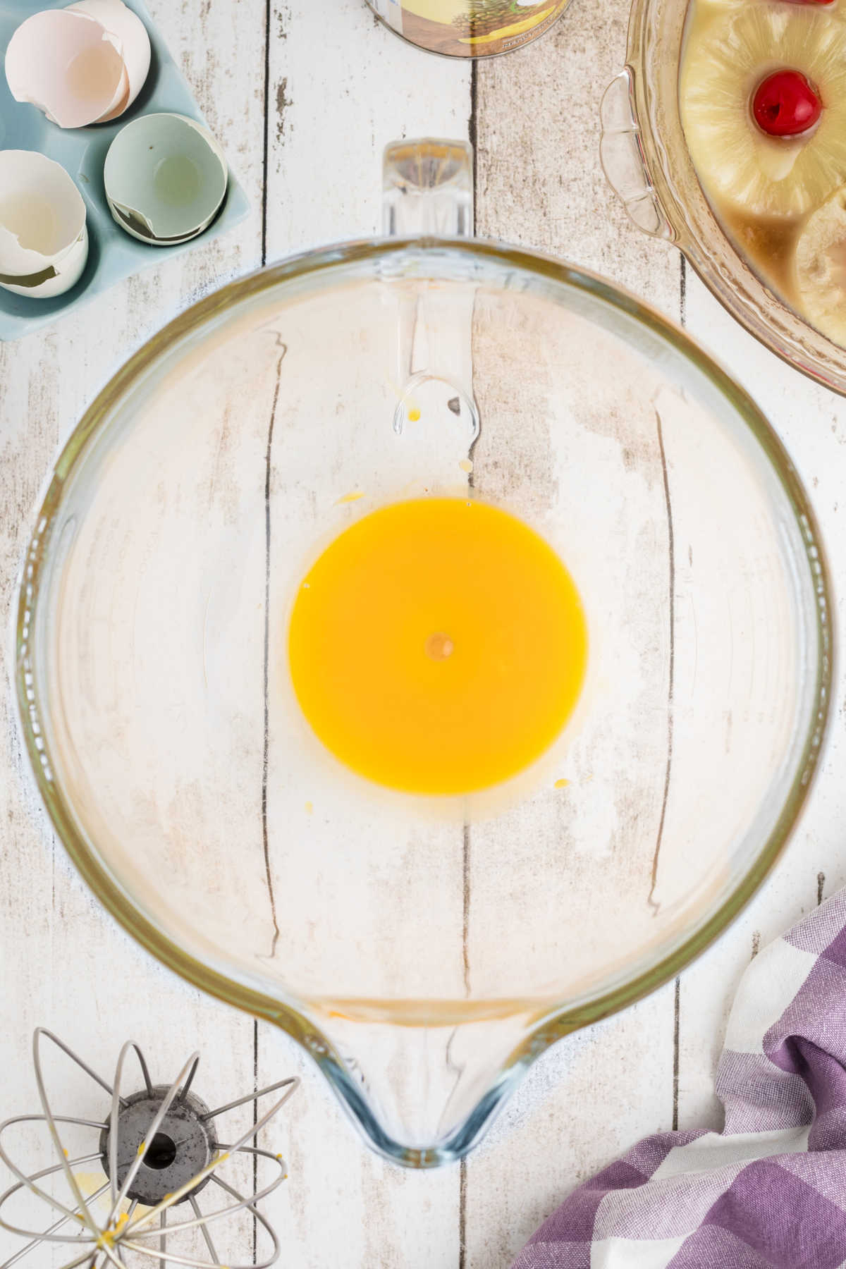 Eggs being beaten in a mixing bowl.
