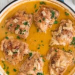 A long image, overhead of smothered chicken, with text overlay for pinterest.