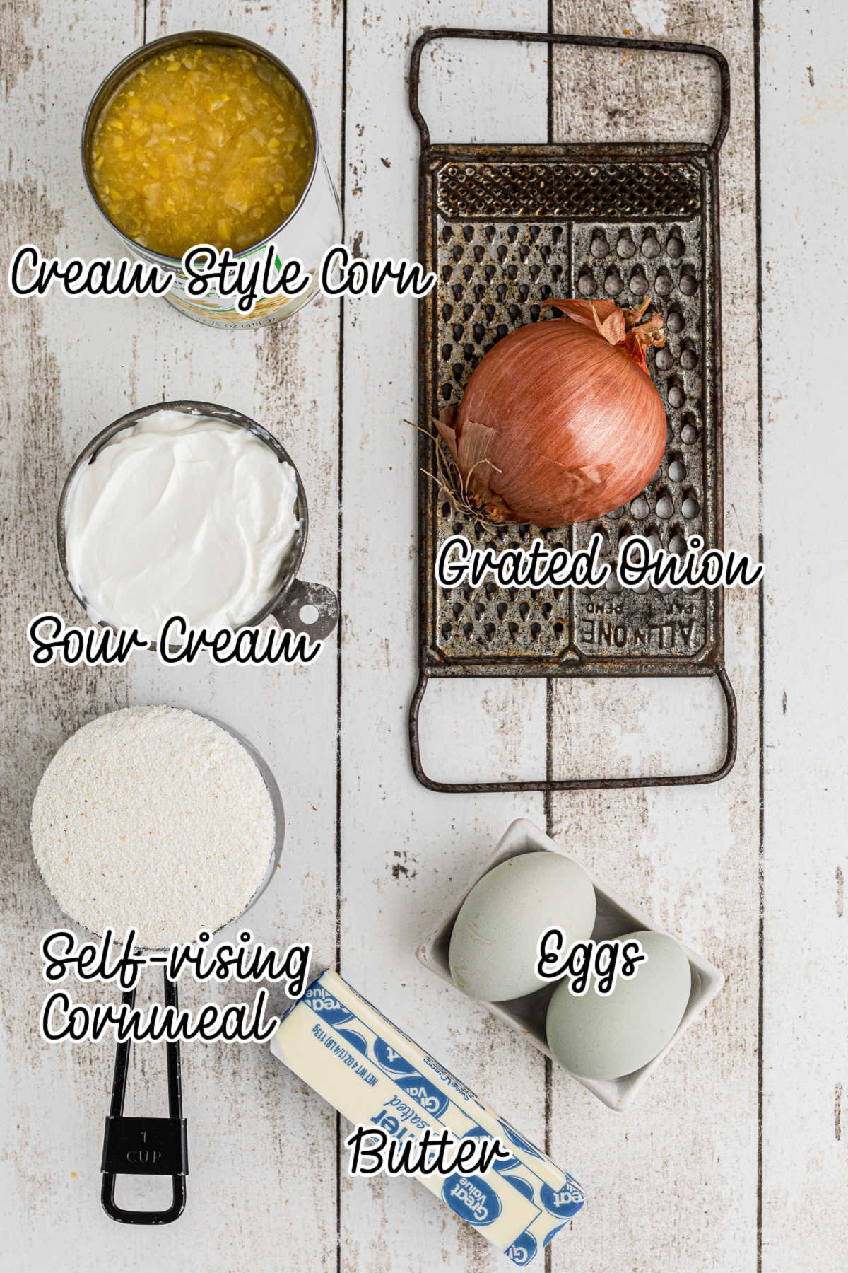 Overhead shot of the ingredients needed to make sour cream cornbread, with text overlay.