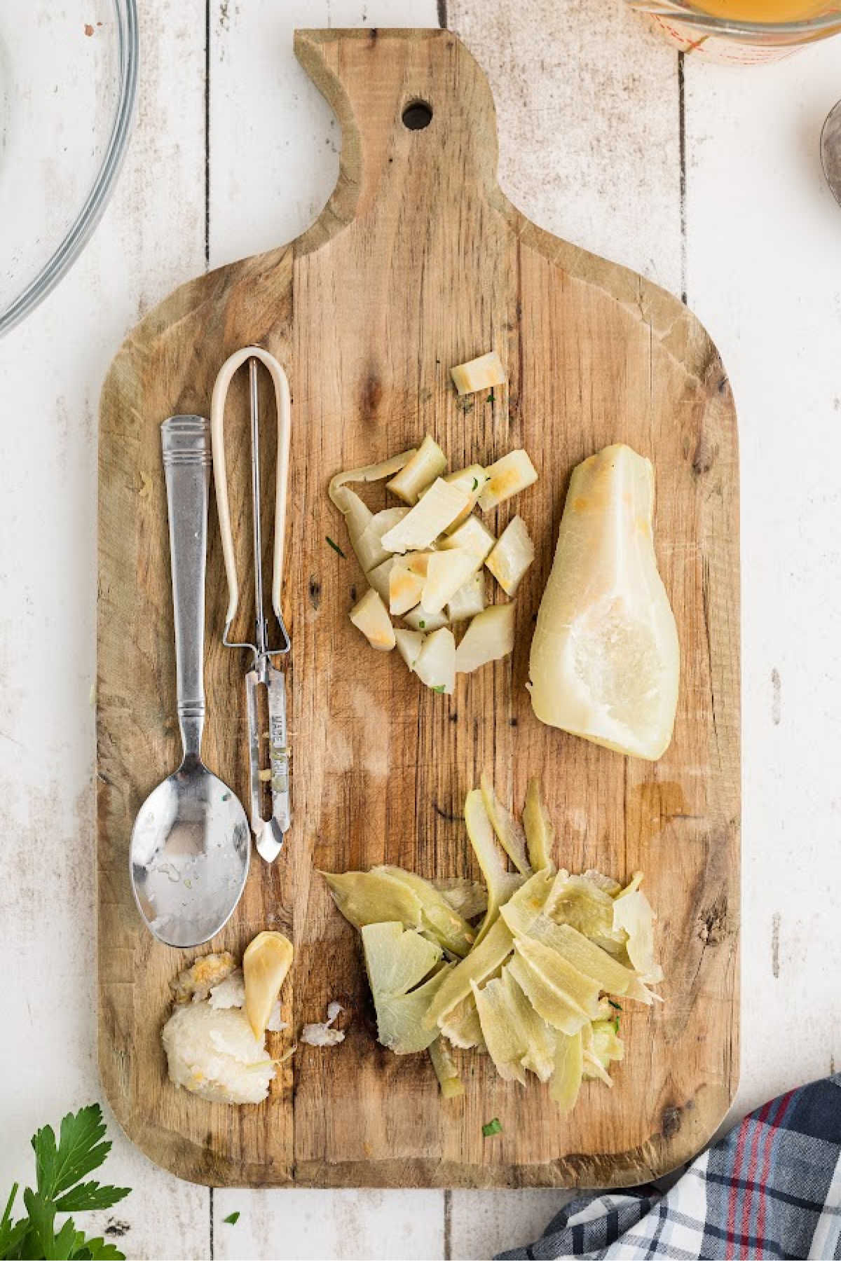 Mirlitons that have been cooked, being peeled and chopped.