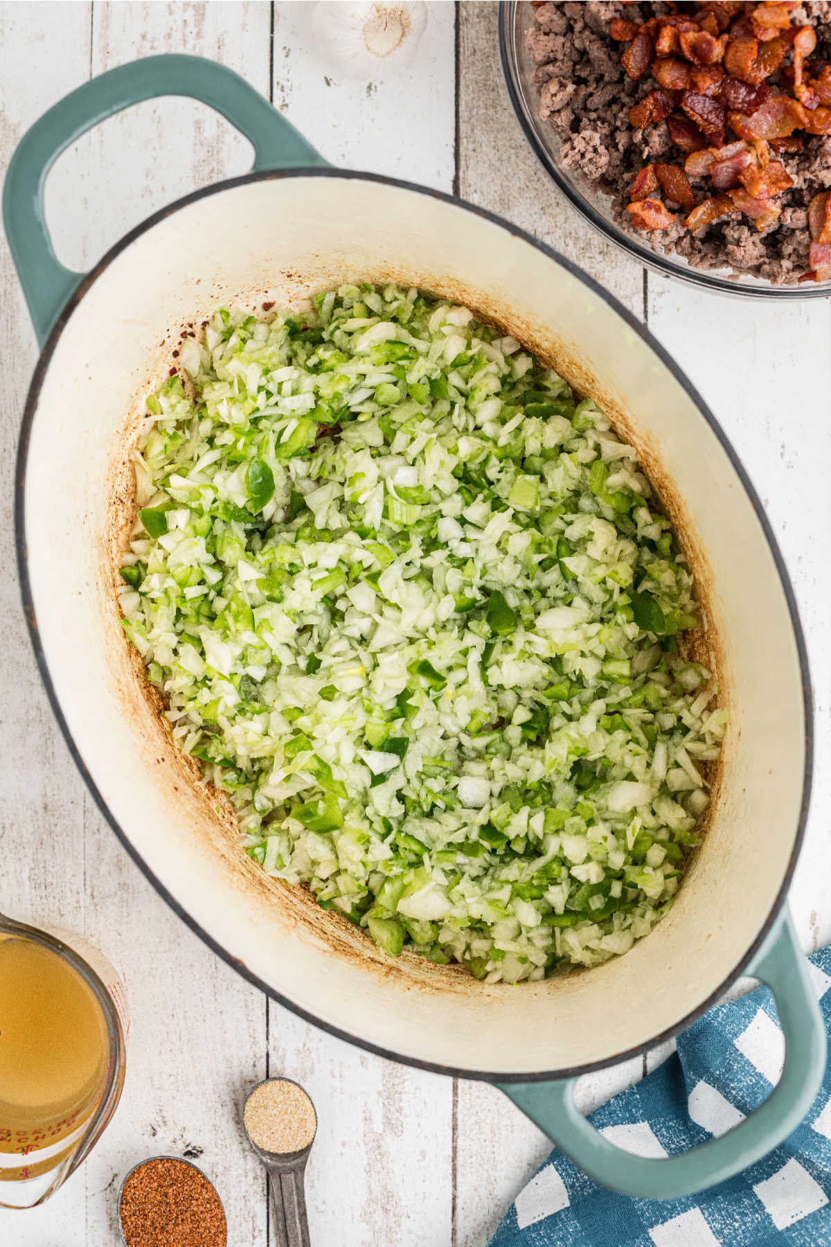 Diced onions, bell peppers and celery in a large Dutch oven.