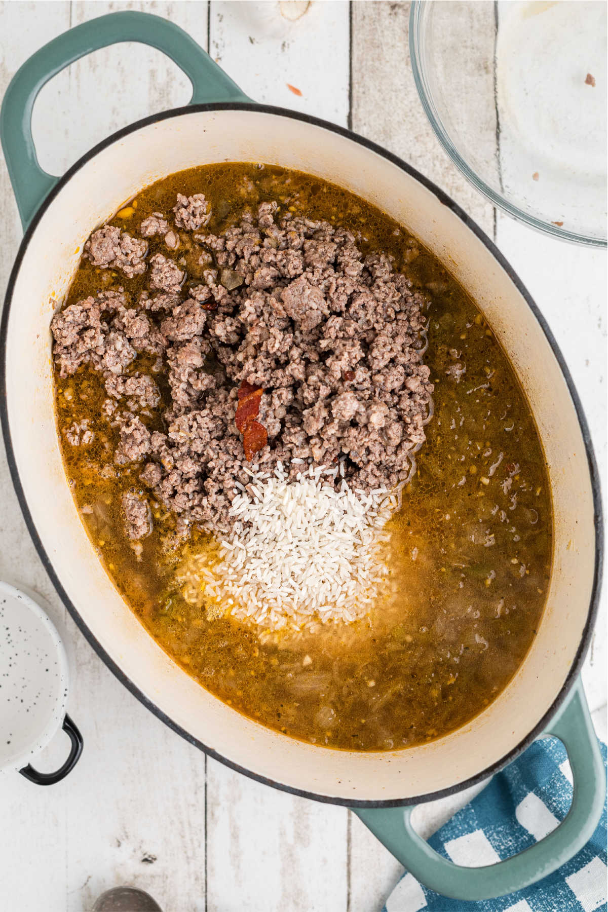 Meat added back to a pot of other ingredients.