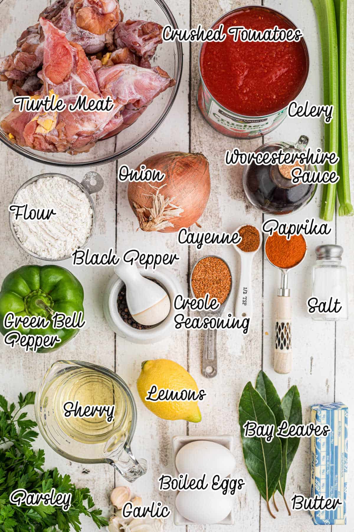 Overhead image of some ingredients that are needed to make a Creole Turtle soup, with text overlay.