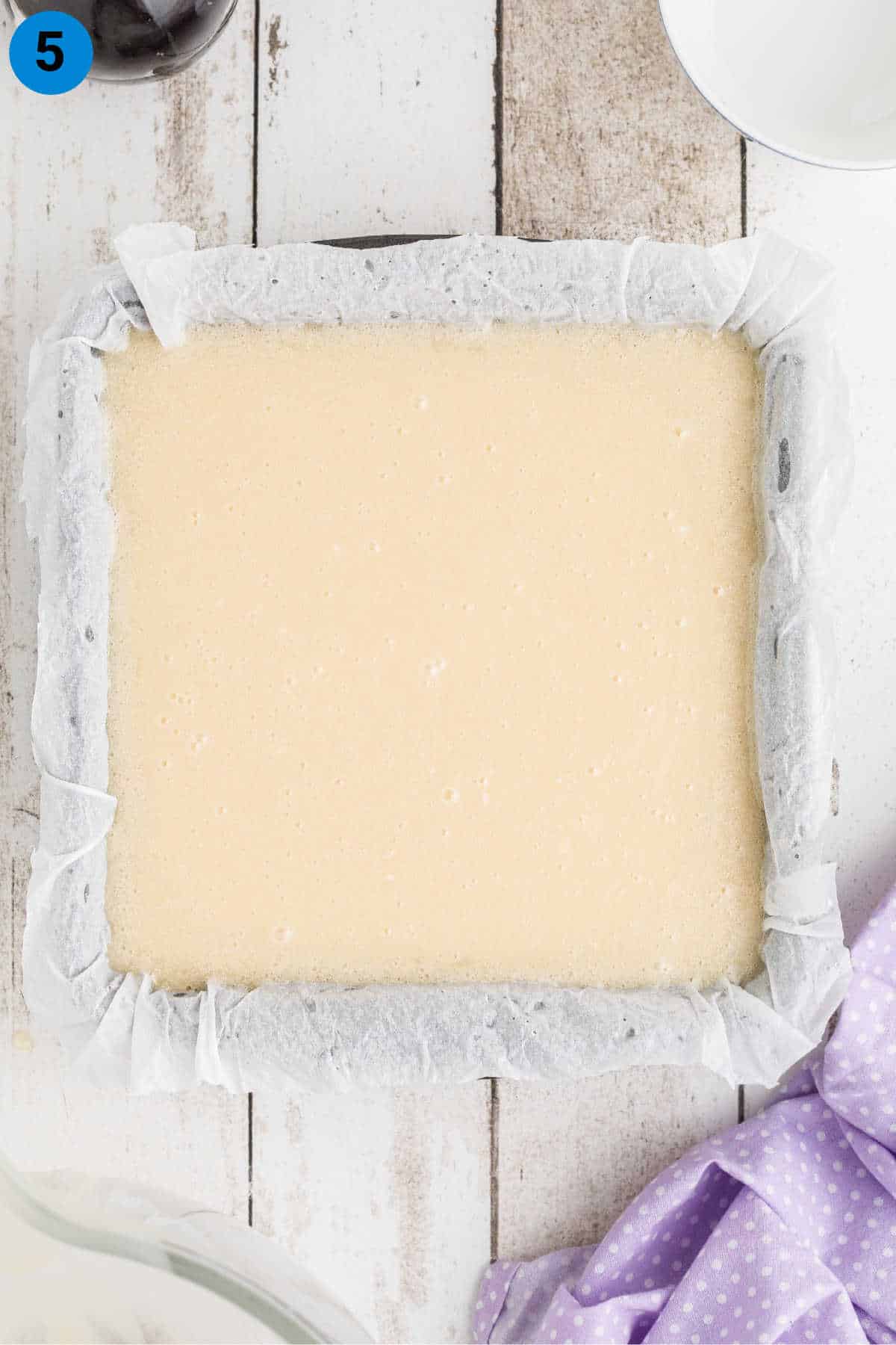 A square pan filled with vanilla fudge.