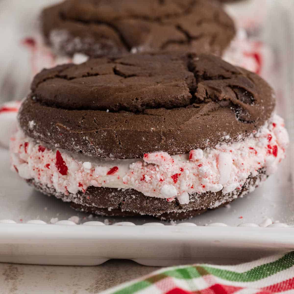 A Close up of a Christmas Whoopie Pie, with crushed peppermints.