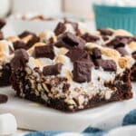 Very close up shot of a rocky road brownie on a granite plate.