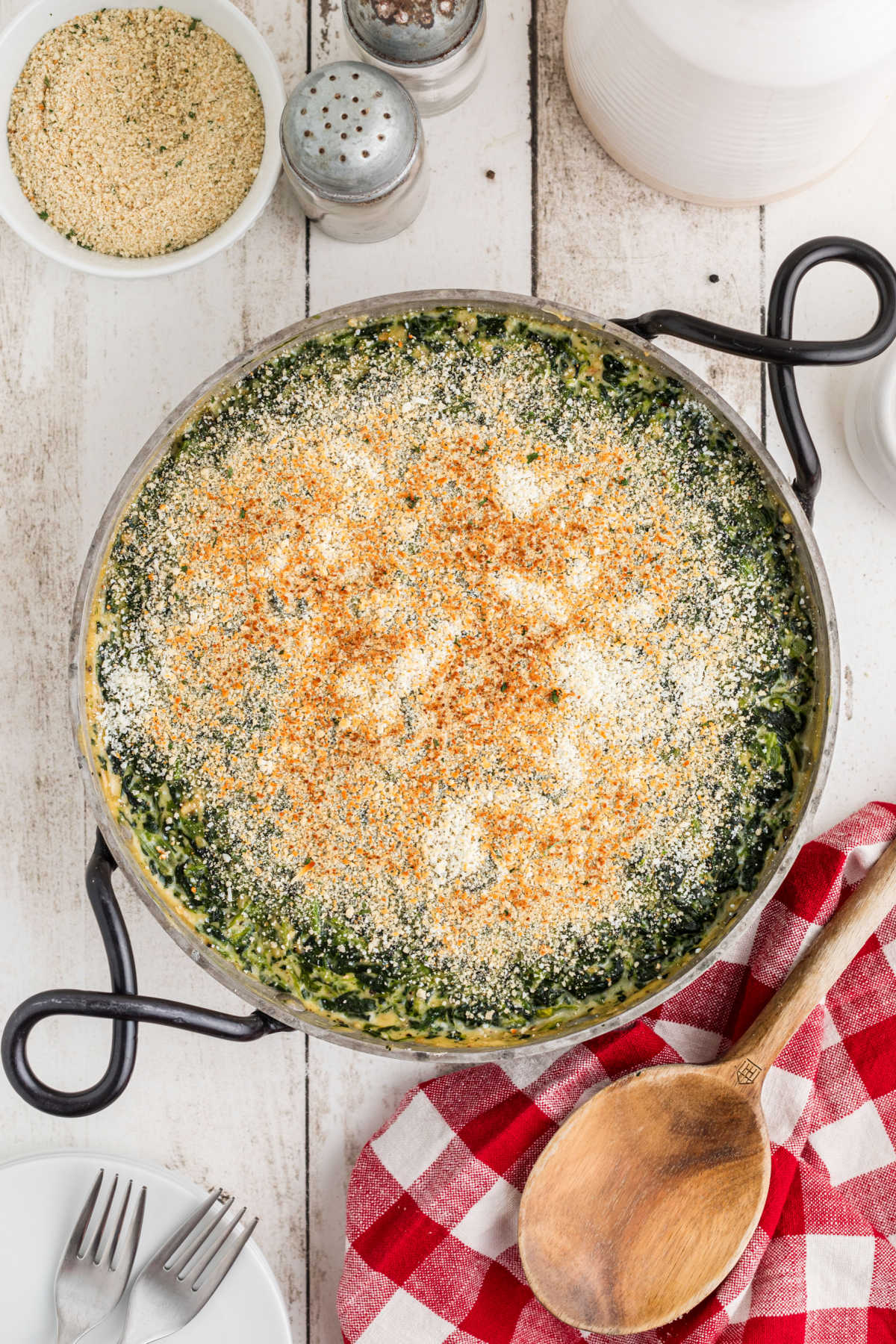 Overhead shot of a spinach madeleine recipe in a pan with cute handles.