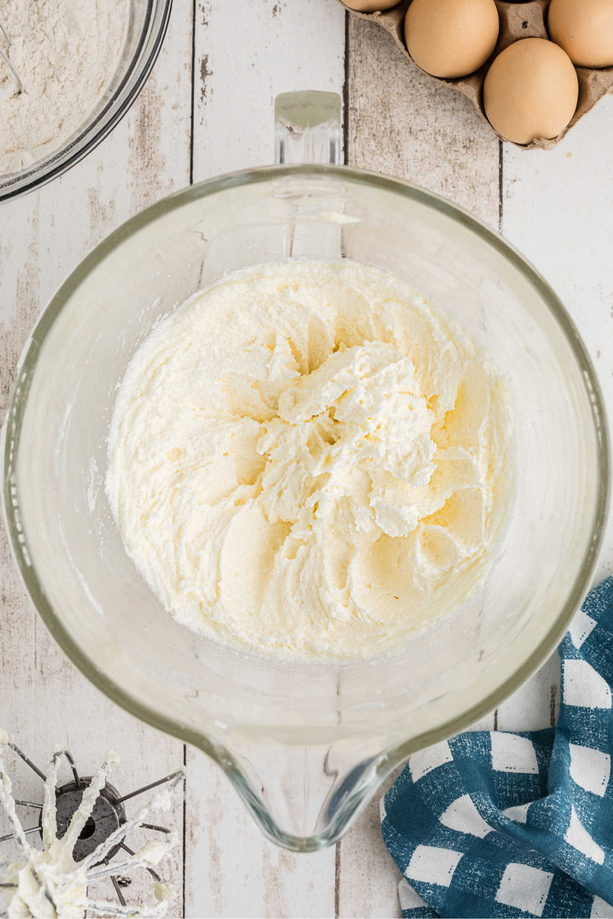 A large mixing bowl with butter and sugar.