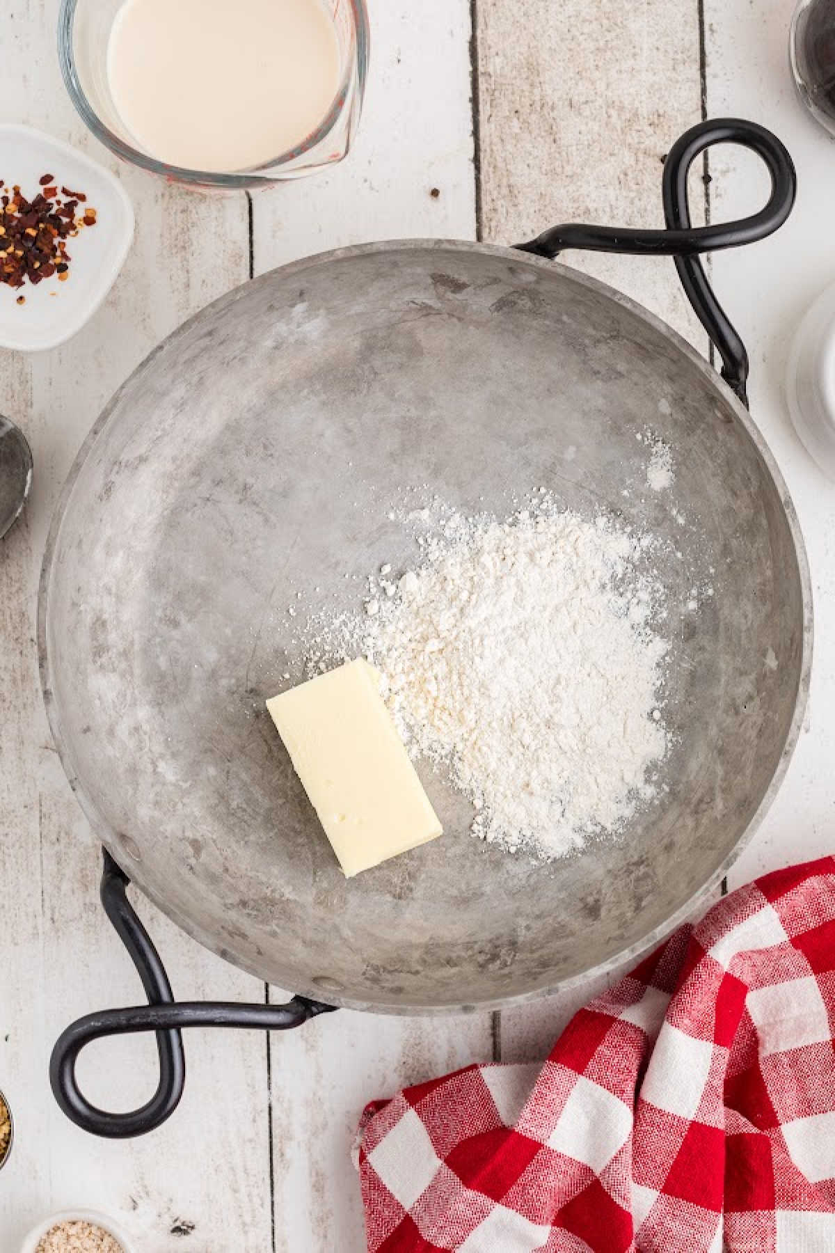 Butter and flour about to be cooked in a skillet.